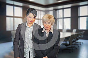 Upset business women in the conference room