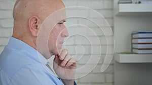 Upset Businessman Thinking Pensive and Troubled Inside Office Room