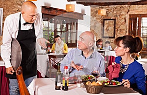 Upset couple complaining to waiter