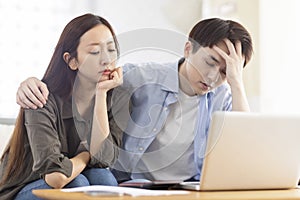 Upset couple frustrated troubled with paying bills expenditures