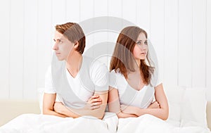 Upset couple having marital problems or a disagreement in bed