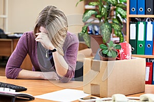 Upset with dismissal woman crying at workplace