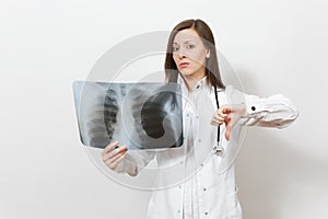 Upset doctor woman show thumb down with X-ray of lungs fluorography roentgen isolated on white background. Female doctor