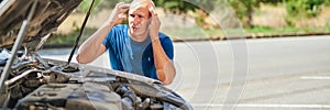Upset driver in front of automobile crash car collision accident in road.