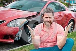 Upset driver man in front of automobile crash car collision accident.