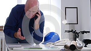 Upset Engineer in Office Try to Make a Phone Call and Gesticulate Nervous