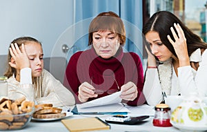 Upset family with documents at home