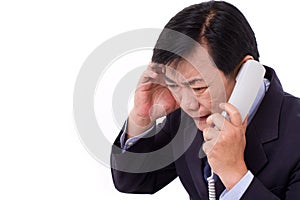 Upset, frustrated manager receiving bad news via telephone call