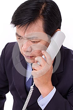 Upset, frustrated manager receiving bad news via telephone call