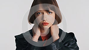 Upset girl with bob hair posing on camera looking bewildered isolated on white background. Face expression