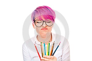 Upset girl with coloring pencils