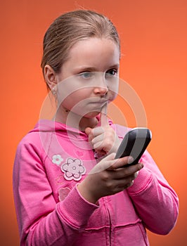 Upset girl holding phone