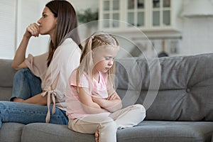 Upset girl and mom ignore each other after fight