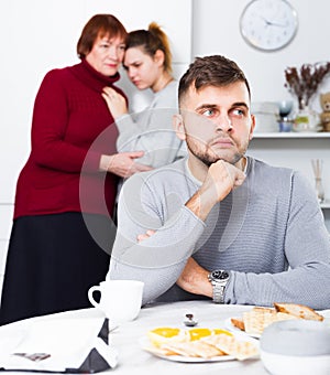 Upset guy after discord with mother and wife