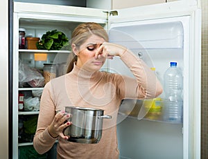 Upset housewife with foul meal