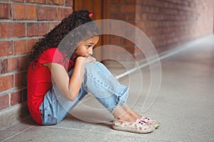 Upset lonely girl sitting by herself