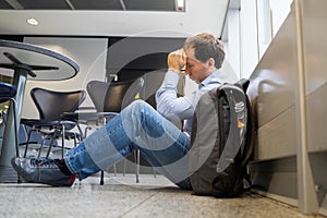 Upset Man In Airport. Flight Delay And Cancellation