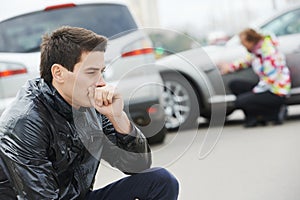 Upset man after car accident