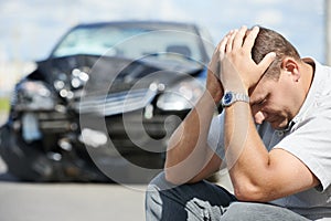 Upset man after car crash