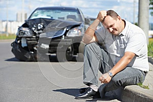 Upset man after car crash