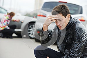 Upset man after car crash