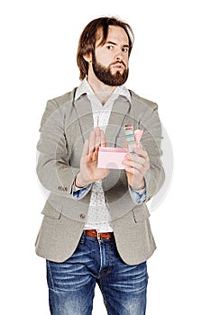 Upset man holding gift box, displeased with what he received, di