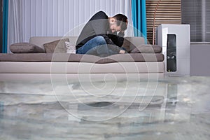 Upset Man In The Room Flooded With Water