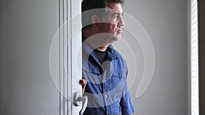 Upset man shutting a door