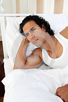 Upset man sleeping separately of his girlfriend
