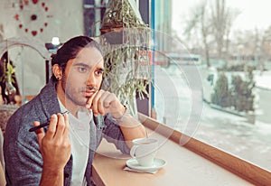 Upset man uninterested by conversation, having a fight by phone photo