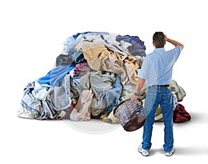 Upset man w laundry basket & huge pile of clothes