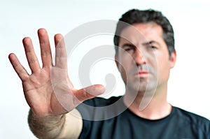 Upset mature man show stop sign with his palm.