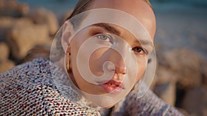 Upset model posing shore in sunlight portrait. Beautiful woman face outdoors
