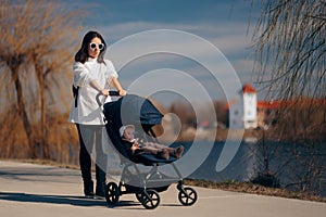 Upset Mom Walking Baby in Pushchair Stroller
