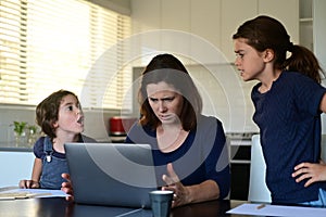 Upset mother forced to work from home as the pandemic coronavirus COVID-19 forces many employees to work from home photo