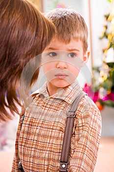 Upset preschooler boy photo