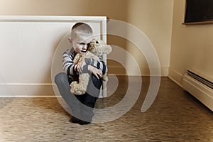 Upset problem child close to the staircase concept for bullying, depression stress