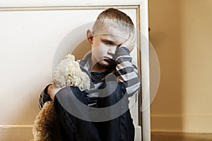 Upset problem child close to the staircase concept for bullying, depression stress