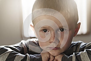 Upset problem child sit on chair concept for bullying, depression stress