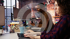 Upset programmer annoyed by computer bugs while coding in IT startup office