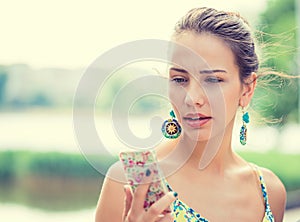 Upset sad woman talking texting on phone displeased photo