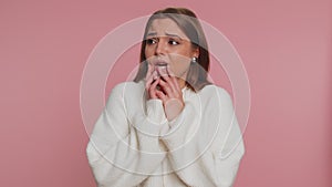 Upset scared young woman biting nails, feeling worried nervous about serious troubles, stress, panic