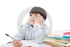 Upset schoolboy doing homework