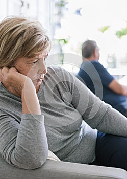 Upset senior couple at home having an argument