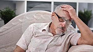 Upset senior man 70s worried about health problem grieving. Medium close up shot on 4k RED camera