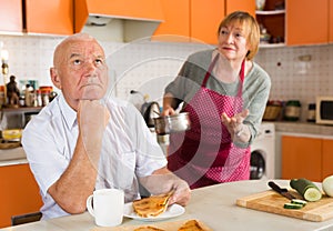 Upset senior man with disgruntled wife