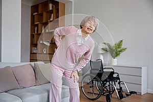 Upset senior woman suffering from radiculitis back pain
