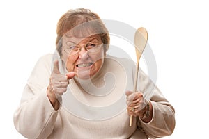 Upset Senior Woman with The Wooden Spoon