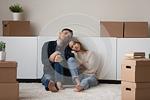 Upset spouses leave house sit on floor near cardboard boxes