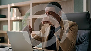 Upset stressed African American man negative emotion fail business project with laptop desperate businessman office